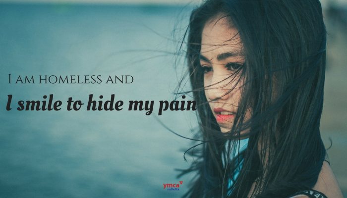 This is an image from the YMCA Awareness Campaign Series from 2017. It says 'I am homeless and I smile to hide my pain'.