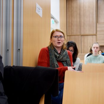 Photo from YMCA Homeinclusration study launch of a guest asking a question in the crowd.