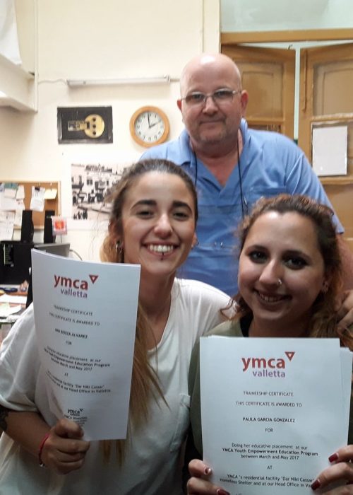 Outgoing interns Ana & Paula receive their certificates of completion.